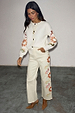 Ecru Enchanted Cut Work Scallop Jeans featuring sun embroidery and a wide-leg fit, paired with a matching cardigan.