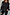 Thumbnail for Black Enchanted Lillie Top with white embroidered cut-out motifs on blouson sleeves and a panelled waist.