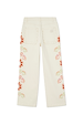 Ecru wide leg jeans featuring scalloped back pockets and colourful sun embroidery along the side seams.