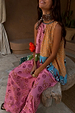 Etta Hankerchief Hem Top with a multi-tonal print and tan sun motif, paired with matching pink patterned trousers.