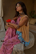 Etta Handkerchief Hem Top in a multi-print with iconic sun motifs and block colours, styled on a model outdoors.