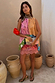 Etta Hankerchief Hem Top featuring a multi-coloured block print with sun motifs, a gathered neck and asymmetric hem.