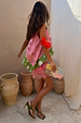 Etta Hankerchief Hem Top in a pink and green multi print, styled with a pink lace skirt and beaded clutch.