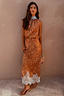 Fawn Midi Maeva Skirt with a brown spotted print and delicate white lace border, shown on a model.