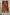 Thumbnail for Fawn Midi Maeva Skirt Petite in a brown spotted print with a pale blue lace trim on a stone background.
