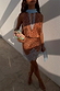 Fawn print Mini Maeva Skirt with light blue lace trim, styled with a matching top and beaded clutch bag.