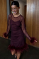 Wine Mesh Feather Mini Dress with sheer sleeves and detachable feather trims at the cuffs and hem.
