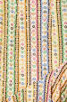 Multicoloured geometric print with metallic gold sun motifs on the Fiesta Remi Midi Dress, designed in-house.