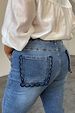 Blue Denim Flare Scallop Jean highlighting the navy scalloped pocket detail on a curve model.