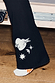 Black cotton wide leg trousers with ecru embroidered heart, bird and star motifs on the flared leg.