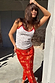 Red Floral Midi Skirt in a white floral print, paired with a coordinating lace-trim pointelle vest co-ord.