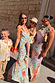 Sky Blue Floral Sofia Dress with tie-knot shoulders and bias-cut silhouette, styled with coordinating family prints.