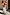 Thumbnail for Sky Blue Floral Sofia Dress with tie-knot shoulders and a bias-cut, shown on a model holding a child in a sunlit setting.