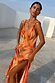 Burnt orange Blurred Floral Sofia Dress with tie shoulder knots, a V-neckline and side slit for wedding guest dressing.