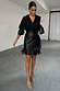 Thumbnail for Black Vegan Leather Mini Fringe Jaspre Skirt with a wrap-tie waist and statement fringe hem.