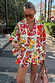 Fruit Stamps Co-ord Set with a vibrant Mediterranean fruit print, including an oversized shirt and tiered frill shorts.