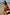Thumbnail for Girls Pink Fruit Crop Bikini Set with Mediterranean fruit print and frill details on a beach vacation.