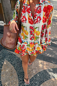 Fruit Stamps Co-ord Set in a Mediterranean fruit print, featuring a white relaxed shirt and matching tiered frill shorts.