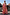 Thumbnail for NFD Kids Pink Fruit Wide Leg Set with a peplum top and frill-hem trousers, shown on a girl for a vacation look.