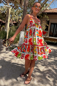 White Fruit Stamps Mini Dress in a tiered silhouette featuring a Mediterranean fruit print and red tassel ties.