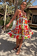 White Fruit Stamps Mini Dress in a tiered silhouette featuring a Mediterranean fruit print and red tassel ties.