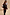 Thumbnail for Geometric Knit Cardigan with iconic palm motifs in autumnal tones, styled with matching black joggers.