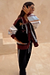 Geometric Knit Cardigan with iconic palm motifs in autumnal tones, styled with matching black joggers.