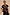 Thumbnail for Geometric Knit Cardigan in autumnal tones with palm motif embroidery and a white blanket stitch collar on a smiling model.
