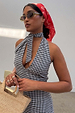 Gingham Halterneck Dress in a monochrome check with a retro tie-neck, styled with a red bandana and straw bag.