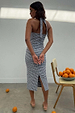 Gingham Halterneck Dress in a black and white chequered print featuring a back slit and tie-neck detail.