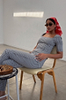 Gingham Top in black and white with a square neckline, styled as a co-ord with matching trousers and a red headscarf.