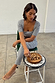 Gingham Top with a deep square neckline in a black and white check, styled as a co-ord while playing chess.