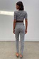 Gingham Trousers and short-sleeve top co-ord in a black and white check with a skinny leg fit, shown from the back.