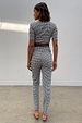 Gingham Trousers and short-sleeve top co-ord in a black and white check with a skinny leg fit, shown from the back.