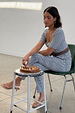 Gingham Trousers and matching top co-ord set in black and white check, worn by a model playing chess.