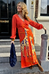 Thumbnail for Orange Giraffe Emma Dress Petite with a crochet knit top and printed viscose skirt on London steps.