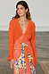 Thumbnail for Orange Giraffe Emma Dress with a crochet knit V-neck top and a glossy viscose skirt featuring a bold giraffe print.