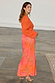 Thumbnail for Orange Giraffe Emma Dress featuring a long-sleeved crochet bodice and a printed maxi skirt on a model.