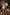 Thumbnail for Girl's blue Starburst Crop Bikini Set with frill trims, walking towards a pool on vacation.