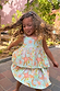 Blue Starburst Skirt Co-ord Set featuring a sun and star print peplum top and tiered cotton skirt on a young girl.