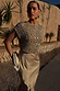 Gold Sequin Elodie Dress with a pearl-embellished mesh top and gold satin skirt, ideal for a wedding guest look.