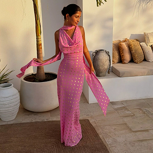 Pink Sophie Dress with gold flecks, a draped neckline and detachable multi-wear scarf, styled on a model.