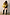 Thumbnail for Gold Fringe Jacket featuring layered metallic tassels, styled with black shorts and knee-high boots.