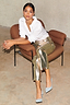 Thumbnail for Gold Vegan Leather Trousers styled with a white shirt and light blue heels for a street style look.