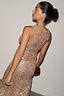 Gold sequin tank top featuring a racerback, worn with a matching skirt for London looks.