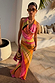 Green Abstract Sabine Maxi Dress in a multicoloured abstract print, featuring a cowl neck and halter-style neckline.