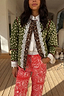 Thumbnail for Green Dallas Reversible Jacket in a quilted deer print with leopard trim and intricate white lace detailing.