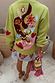Green Enchanted Cardigan featuring colourful NFD motifs and embroidery on a soft green knit.