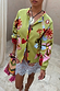 Thumbnail for Green Enchanted Cardigan with NFD motifs and multi-coloured trim, styled over a lace dress.