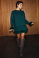 Bottle Green Jamie Jumper with detachable feather trims, styled as a co-ord with a matching skirt and tall boots.